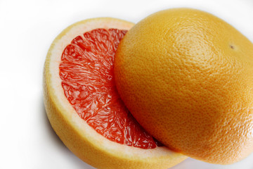 Grapefruit halves very close up on a white background