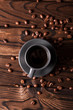 Cup of hot fresh black coffee on vintage wooden table