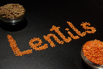 two types of cereal lentils on a dark background and the word 