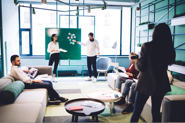 Wall Mural - Work partners having conversation in hall of workplace