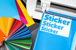 production making sticker with plotter cutting machine CMYK cyan blue colored vinyl fim with color fan. guide. Advertising Industry diy design concept background.