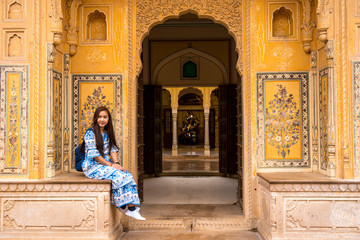 Woman posing in Jaipur from Nahargarh Fort at sunset