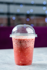 Poster - raspberry smoothie in a plastic takeaway glass