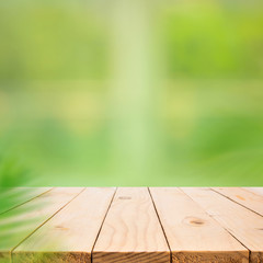 Wall Mural - Empty wood table top on blur abstract green garden from window view