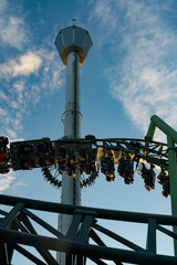 People screaming and holding up hands during roller coaster ride Helix at Liseberg amusement park Gothenburg Sweden - People having fun at their leisure.