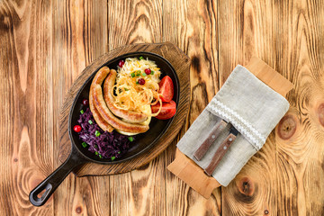 Sticker - homemade food pan with grilled sausages and vegetables