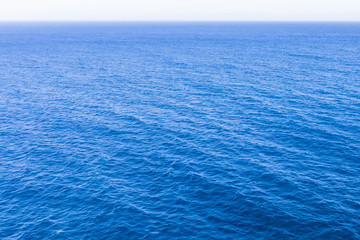 Wall Mural - Classic blue sea with a perspective into the distance horizon.