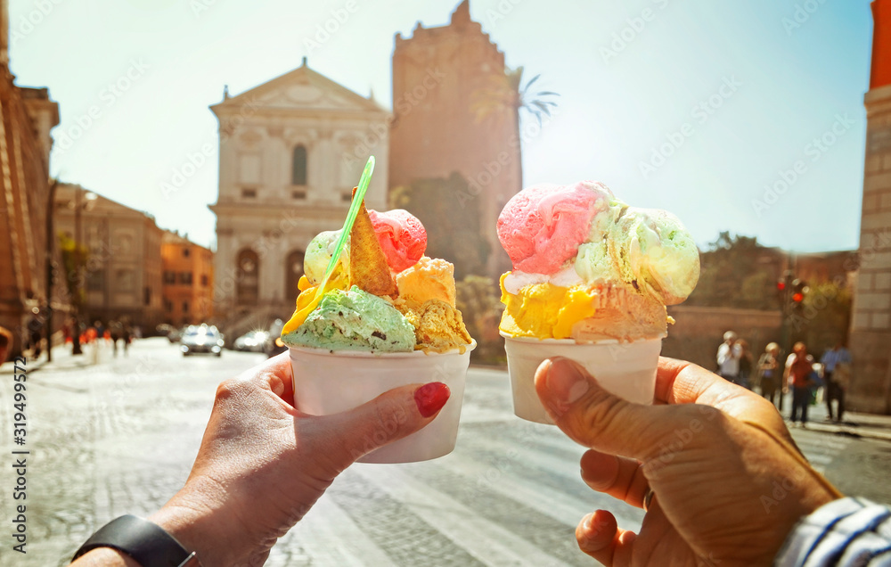 Couple with beautiful bright sweet Italian ice-cream with different flavors in the hands - obrazy, fototapety, plakaty 
