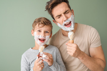 Poster - Funny father and his little son shaving against color background