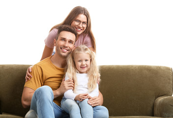 Sticker - Happy young family sitting with sofa on white background