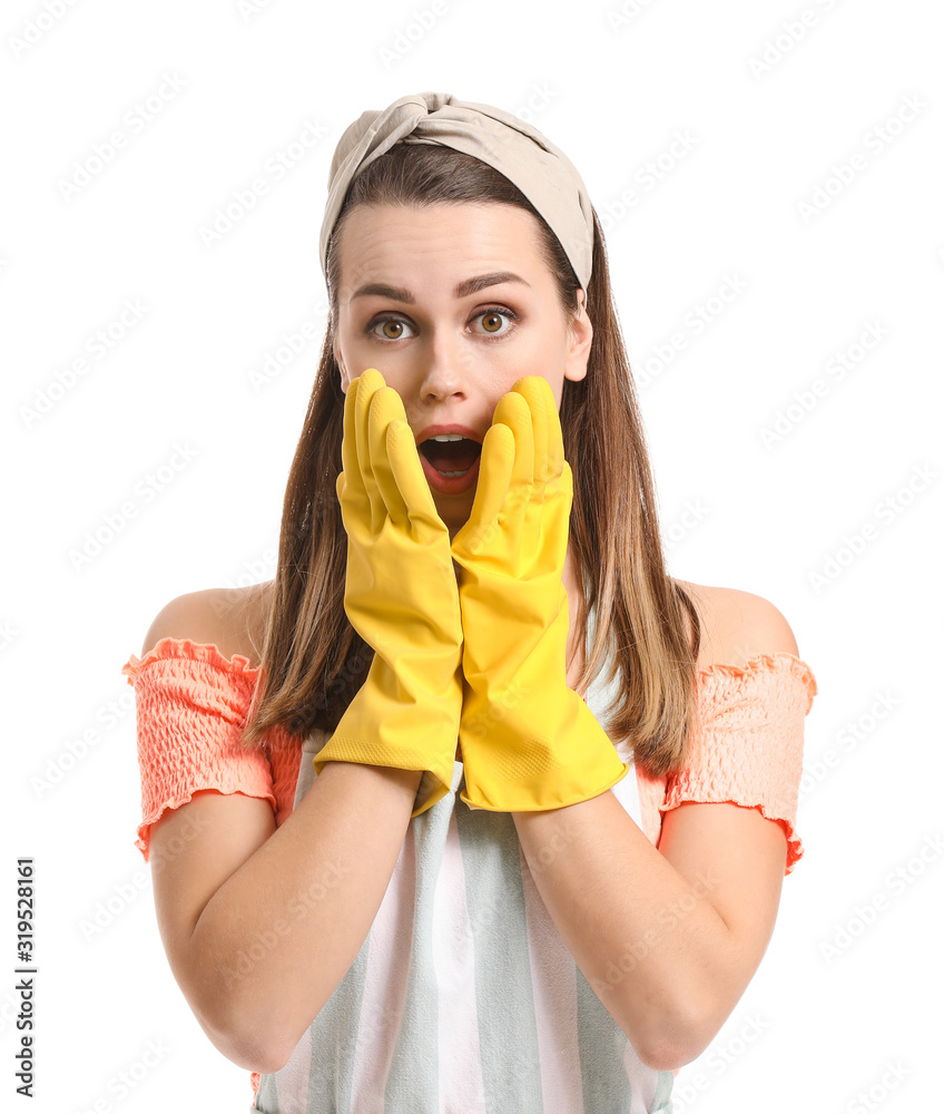 Surprised young housewife on white background