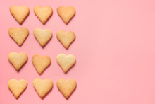 Border Of Homemade Heart Shaped Cookies On Pink. Flat Lay.