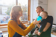 © Westend61 - Family in the kitchen at home