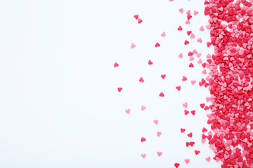 Wall Mural - Heart shaped sprinkles on white background