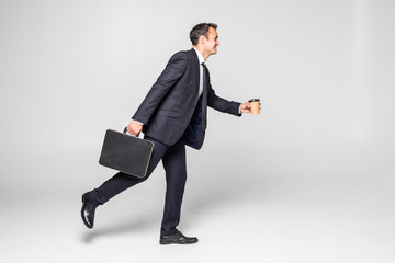 Wall Mural - Businessman running with a briefcase isolated over white background