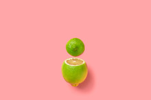 Sliced Yellow Green Lemon Lime On A Pink Background
