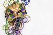 mardi gras mask and beads for party