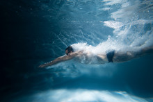 Professional Swimmer Underwater After The Jump