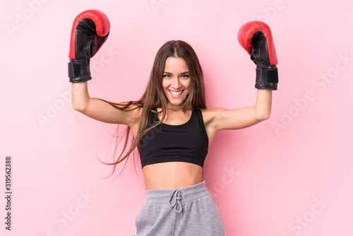 Young caucasian sporty woman boxing