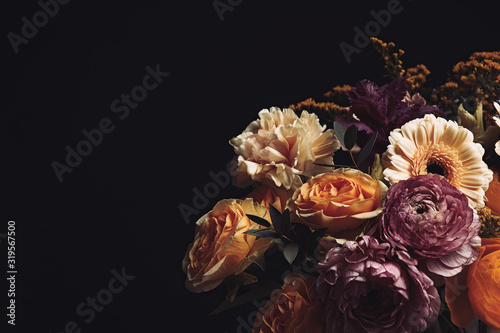 Beautiful bouquet of different flowers on black background, space for text. Floral card design with dark vintage effect