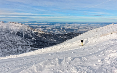 Canvas Print - Downhill Skier on top of Kasprowy Wierch in Zakopane in Tatras in winter.Zakopane is a town in Poland in Tatra Mountains.Kasprowy Wierch is mountain in Zakopane and the most popular ski area in Poland