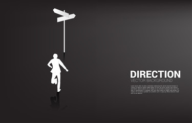 Poster - Silhouette of businessman standing at direction signage. Concept of time to make decision in business direction