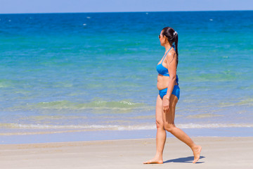 Wall Mural - Woman happy with bikini blue on beach at Ban Krut