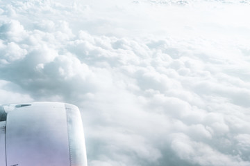 Wall Mural - airplane window view above beautiful white cloud summer blue sky and sun light abstract nature.