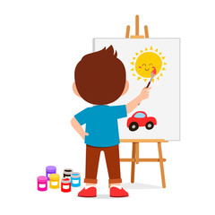 happy cute little kid boy draw on canvas