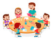 © Colorfuel Studio - happy cute little kids boy and girl make paper craft with teacher