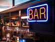 Bar Neon sign with Blur counter bar background
