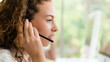 business background of caucasian female call center agent on service with call from customer at customers relation and helpdesk center