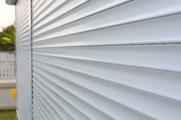 white roller shutter door closed security in modern house