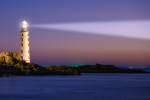 Lighthouse On Sea Sunset With Light Beacon At Night Landscape