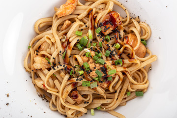 Stir fry with soba noodles, shrimps and vegetables. Asian healthy food, stir fried meal in bowls. Spicy noodles. Stir fry with soba noodles, shrimps (prawns) and vegetables. Indo-chinese cuisine hot d