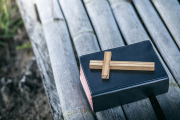 Poster - wooden Cross with bible, Close up, christian worship concept.