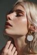 © vickyrandom - Fashion beauty portrait of young beautiful woman wearing earrings.