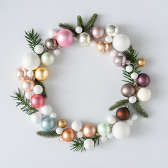 natural christmas wreath with green pine tree branches and ball decoration. creative copy space layo