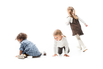 funny multicultural children playing together, isolated on white