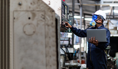 Wall Mural - Officials from the Department of Hazardous substances control bureau is investigating the leak of a hazardous chemical in a chemical plant. Man with protective mask and computer laptops in factory