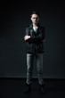© LIGHTFIELD STUDIOS - stylish brutal man posing in biker jacket on black