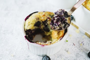 Poster - Homemade Blueberry Muffin for one baked in a ramekin, selective focus