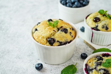 Wall Mural - Homemade Blueberry Muffin for one baked in a ramekin, selective focus