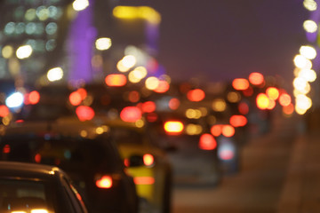 Wall Mural - Defocused photography of traffic on the city street. Road if filled our by cars. Rush hours. Lifestyles of big city concepts. Back view.