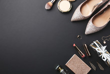 Flat Lay Composition With Cosmetics And Stylish Accessories On Black Background. Space For Text
