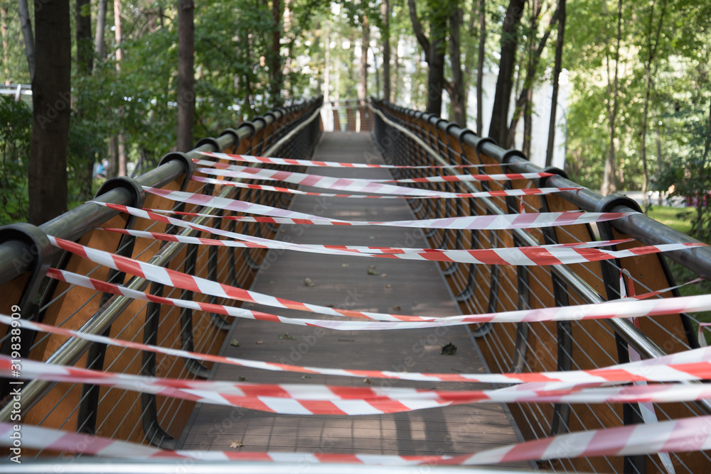 Vedada the entrance is blocked by a red and white warning tape, workers are ...