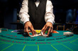 Dealer shuffles the cards in casino