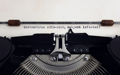 Fototapete - Old retro vintage typewriter with typed heading Coronavirus 2019-nCov Subject infected