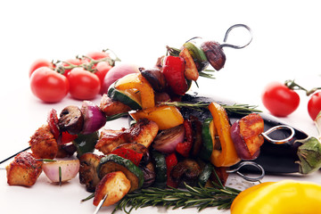 Wall Mural - Grilled pork shish or kebab on skewers with vegetables . Food background shashlik