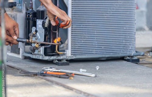 Fotomural Close up of Air Conditioning Repair team use fuel gases and oxygen to weld or cu